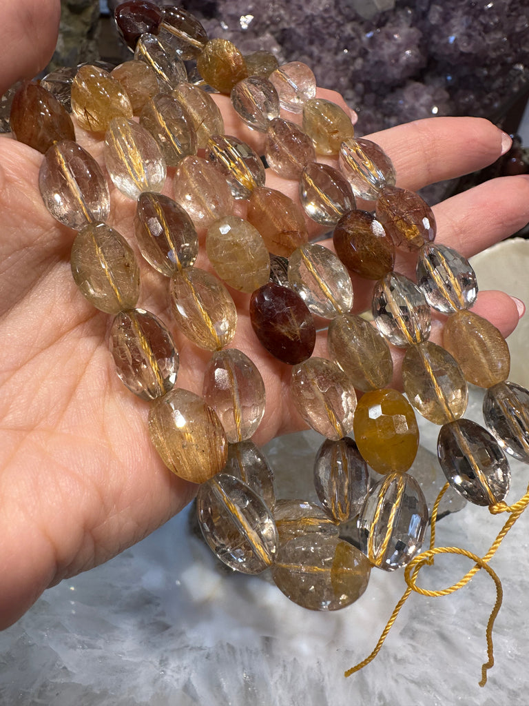 Rutile copper gold quartz 14mm bevel faceted gemstone