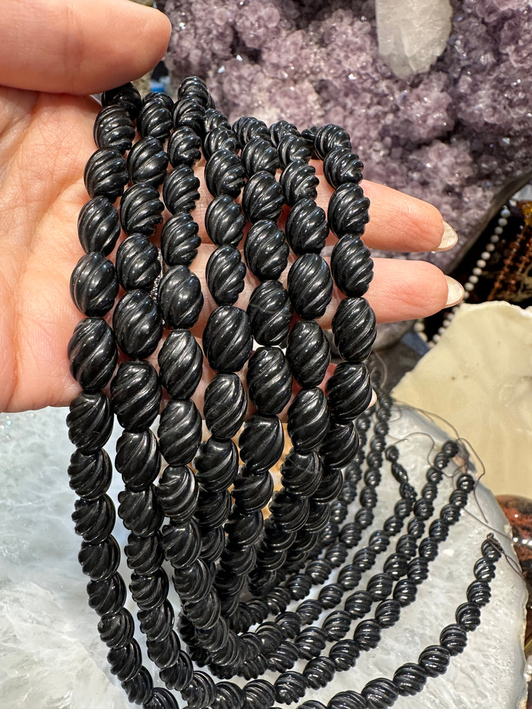 Black onyx oval carved twist 12mm gemstone beads